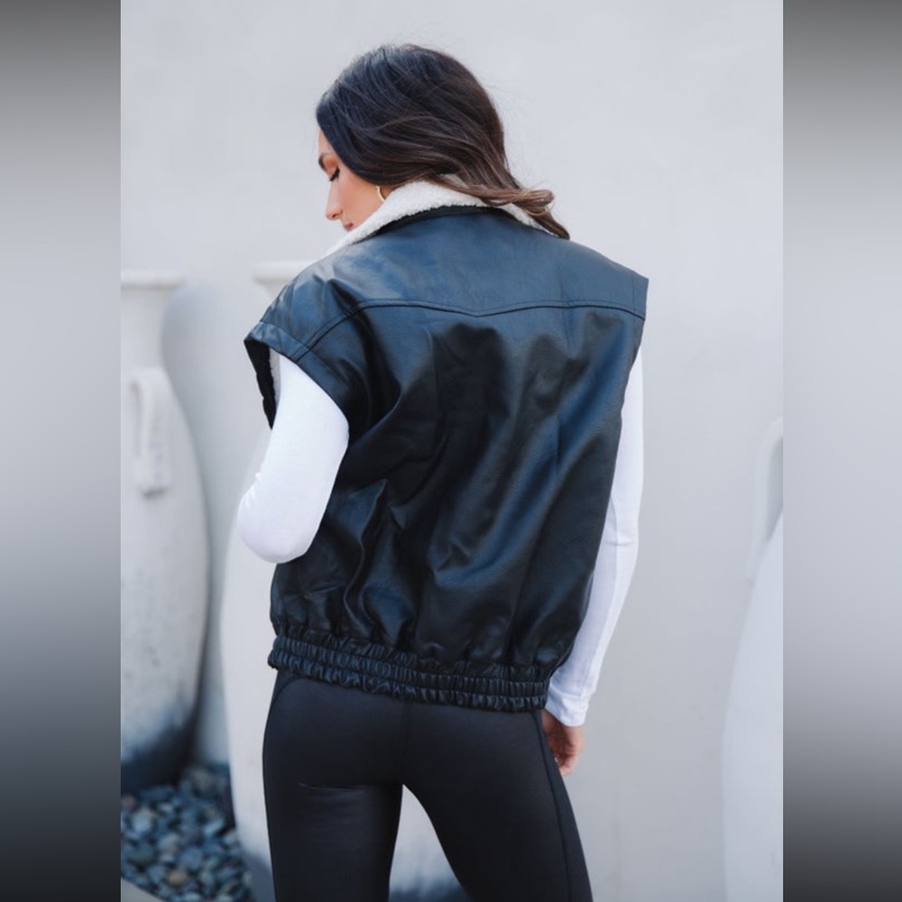 Black leather/sherpa vest